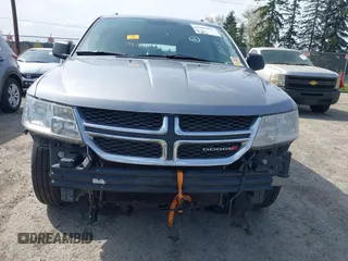 2016 Dodge Journey SE with VIN 3C4PDCAB2GT102871, listed as a IAAI auction lot 42009827 with 197,646 mi miles. Bid and sale history available at carsss.com. Image 6.