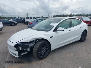 2025 Tesla Model 3 Long Range with VIN 5YJ3E1EA0SF932385, listed as a IAAI auction lot 41772613 with 1,683 mi miles and . Bid and sale history available at carsss.com. Image 2.