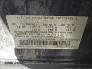 2006 Mazda 3 i with VIN JM1BK12F861468765, listed as a IAAI auction lot 41672325 with 247,918 mi miles. Bid and sale history available at carsss.com. Image 9.
