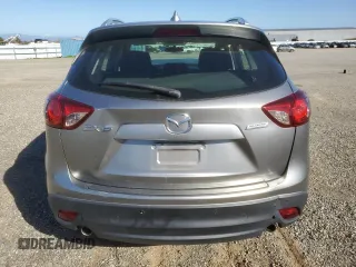 2014 Mazda CX-5 Sport with VIN JM3KE2BE1E0350718, listed as a Copart auction lot 46370205 with 98,065 mi miles and Salvage title. Bid and sale history available at DreamBid. Image 6.