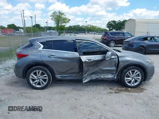 2018 Infiniti QX30 Premium z VIN SJKCH5CPXJA003377, wystawiony jako IAAI lot #41876556 z przebiegiem 91 673 mil mil oraz . Historia ofert i sprzedaży dostępna na DreamBid. Obrazek 13.
