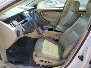 2013 Ford Taurus Limited with VIN 1FAHP2F8XDG154158, listed as a Copart auction lot 52065505 with 148,451 mi miles and Salvage Title. Bid and sale history available at DreamBid. Image 7.