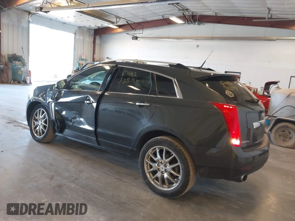 2014 Cadillac SRX Premium Collection z VIN 3GYFNGE38ES606731, wystawiony jako IAAI lot #41844450 z przebiegiem 156 541 mil mil oraz . Historia ofert i sprzedaży dostępna na DreamBid. Obrazek 3.