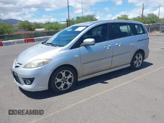 2009 Mazda 5 Sport with VIN JM1CR293990334438, listed as a IAAI auction lot 42561953 with 118,178 mi miles and . Bid and sale history available at DreamBid. Image 2.