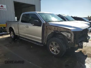 2015 Ford F-150 XL with VIN 1FTEX1C88FFC26544, listed as a Copart auction lot 48242705 with 124,731 mi miles and Salvage Title. Bid and sale history available at carsss.com. Image 4.