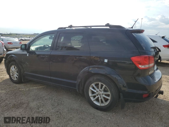 2015 Dodge Journey SXT with VIN 3C4PDCCG5FT559021, listed as a Copart auction lot 60101335 with 323,930 mi miles and Salvage title. Bid and sale history available at DreamBid. Image 2.