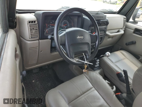 2004 Jeep Wrangler SE with VIN 1J4FA29164P797604, listed as a Copart auction lot 59978155 with 166,888 mi miles and Clean title. Bid and sale history available at DreamBid. Image 8.