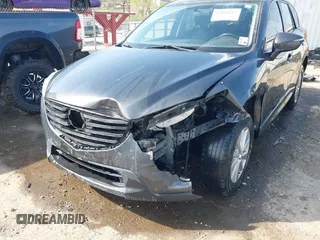 2016 Mazda CX-5 Touring with VIN JM3KE4CY3G0672977, listed as a IAAI auction lot 41889137 with 130,593 mi miles. Bid and sale history available at carsss.com. Image 6.