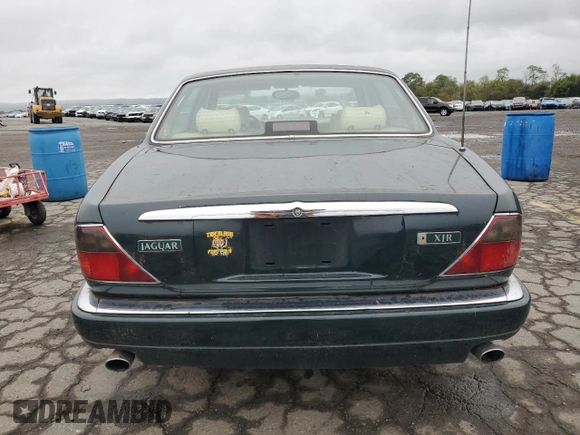 1996 Jaguar XJ with VIN SAJHX1741TC758740, listed as a Copart auction lot 73377914 with 140,964 mi miles and Salvage title. Bid and sale history available at DreamBid. Image 6.
