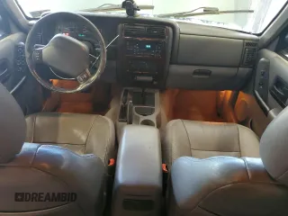 1998 Jeep Cherokee Country with VIN 1J4FT78S8WL252502, listed as a Copart auction lot 59664545 with 133,148 mi miles and Salvage title. Bid and sale history available at DreamBid. Image 8.