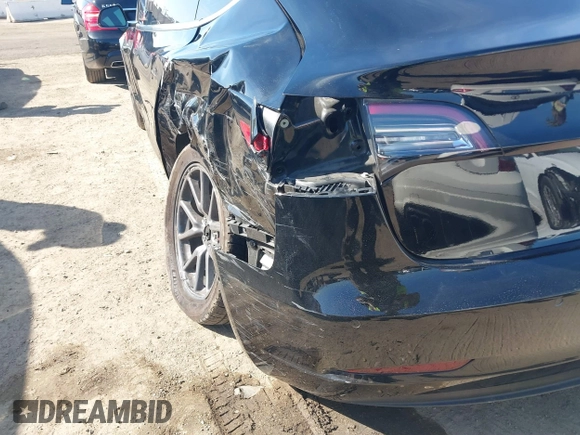 2018 Tesla Model 3 Long Range Battery with VIN 5YJ3E1EA0JF056979, listed as a IAAI auction lot 41865849 with 97,319 mi miles. Bid and sale history available at carsss.com. Image 19.