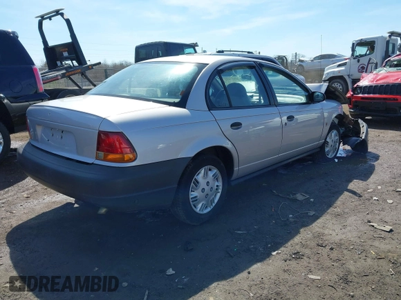 1999 Saturn SL z VIN 1G8ZH5281XZ376254, wystawiony jako IAAI lot #41857372 z przebiegiem 229 836 mil mil oraz . Historia ofert i sprzedaży dostępna na DreamBid. Obrazek 4.