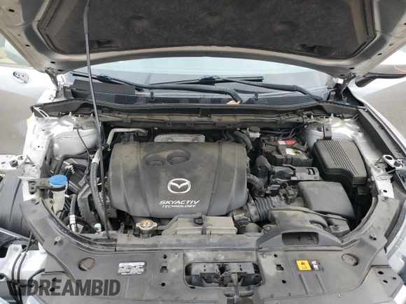 2015 Mazda CX-5 Sport z VIN JM3KE2BE4F0459532, wystawiony jako Copart lot #61049235 z przebiegiem 149 808 mil mil oraz Szkoda całkowita • Salvage title. Historia ofert i sprzedaży dostępna na DreamBid. Obrazek 12.