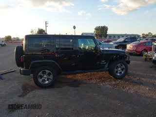 2018 Jeep Wrangler JK Unlimited Sahara with VIN 1C4HJWEG0JL810480, listed as a IAAI auction lot 41260609 with 69,776 mi miles. Bid and sale history available at carsss.com. Image 14.