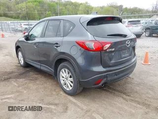 2014 Mazda CX-5 Touring with VIN JM3KE2CYXE0332517, listed as a IAAI auction lot 42109592 with 138,214 mi miles. Bid and sale history available at carsss.com. Image 3.