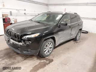 2014 Jeep Cherokee Latitude with VIN 1C4PJMCS0EW321380, listed as a IAAI auction lot 41597508 with 173,991 mi miles. Bid and sale history available at carsss.com. Image 2.