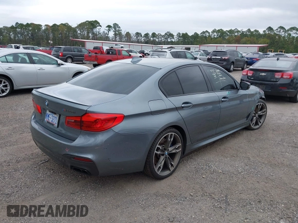 2019 BMW 5 Series M550i xDrive with VIN WBAJB9C57KB289439, listed as a IAAI auction lot 40634389 with 85,992 mi miles and . Bid and sale history available at DreamBid. Image 4.