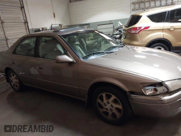1999 Toyota Camry LE z VIN JT2BF28K7X0167855, wystawiony jako IAAI lot #41609230 z przebiegiem 242 398 mil mil oraz . Historia ofert i sprzedaży dostępna na DreamBid. Obrazek 13.