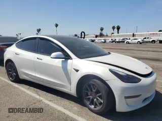 2023 Tesla Model 3 with VIN 5YJ3E1EA8PF394705, listed as a Copart auction lot 52319945 with 58,193 mi miles and Salvage title. Bid and sale history available at DreamBid. Image 4.
