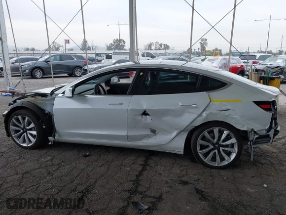 2020 Tesla Model 3 Long Range with VIN 5YJ3E1EB5LF801530, listed as a IAAI auction lot 41682050 with 65,743 mi miles. Bid and sale history available at carsss.com. Image 14.
