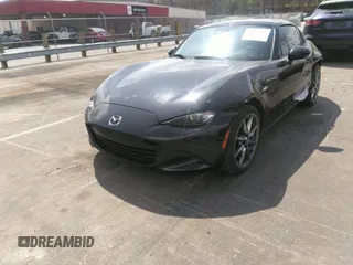 2021 Mazda MX-5 Miata Grand Touring z VIN JM1NDAM75M0451597, wystawiony jako IAAI lot #41932712 z przebiegiem 61 710 mil mil oraz . Historia ofert i sprzedaży dostępna na DreamBid. Obrazek 21.