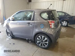 2012 Scion iQ with VIN JTNJJXB07CJ018013, listed as a Copart auction lot 57101085 with 91,370 mi miles and Non repairable. Bid and sale history available at DreamBid. Image 2.