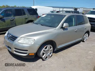 2004 Volkswagen Touareg with VIN WVGCM67L44D033856, listed as a IAAI auction lot 42142143 with 105,682 mi miles and . Bid and sale history available at DreamBid. Image 2.