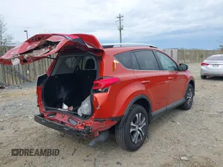 2016 Toyota RAV4 LE with VIN 2T3BFREV6GW516014, listed as a IAAI auction lot 41940997 with 74,129 mi miles. Bid and sale history available at carsss.com. Image 4.
