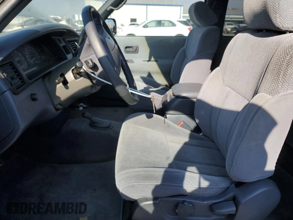 1997 Toyota T100 SR5 with VIN JT4UN24D8V0047084, listed as a Copart auction lot 82485654 with 181,596 mi miles and Salvage Title. Bid and sale history available at DreamBid. Image 7.