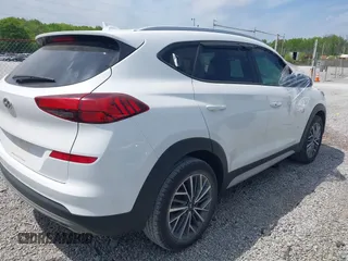 2019 Hyundai Tucson Sport with VIN KM8J33AL5KU066119, listed as a IAAI auction lot 42041651 with 60,281 mi miles. Bid and sale history available at carsss.com. Image 4.