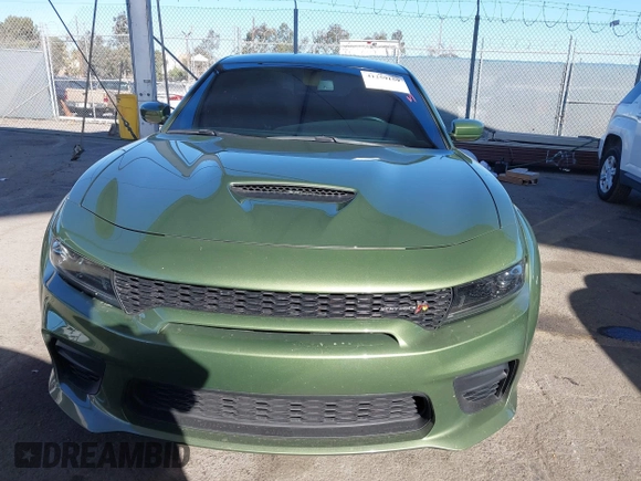 2022 Dodge Charger Scat Pack Widebody with VIN 2C3CDXGJ1NH216763, listed as a IAAI auction lot 41259159 with 32,610 mi miles and . Bid and sale history available at DreamBid. Image 12.