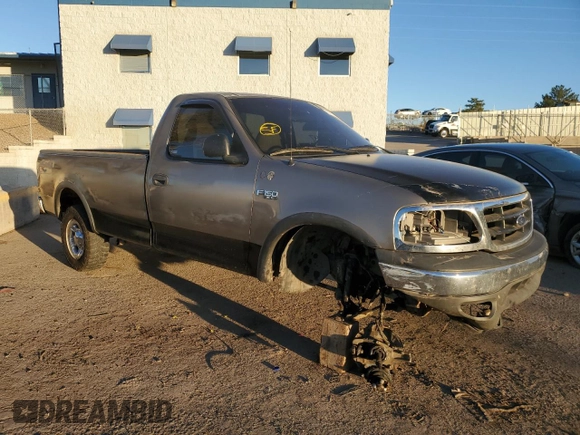 2002 Ford F-150 XL with VIN 1FTRF18262NB35586, listed as a Copart auction lot 77114114 with 166,942 mi miles and Salvage title. Bid and sale history available at DreamBid. Image 4.