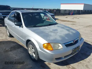 2000 Mazda Protege ES with VIN JM1BJ2213Y0284890, listed as a IAAI auction lot 42088671 with 215,104 mi miles and . Bid and sale history available at DreamBid. Image 1.