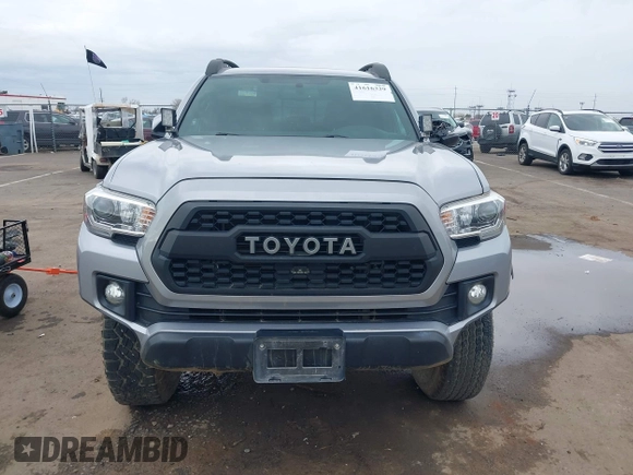 2017 Toyota Tacoma SR5 with VIN 3TMCZ5AN8HM051829, listed as a IAAI auction lot 41616329 with 64,113 mi miles and . Bid and sale history available at DreamBid. Image 12.