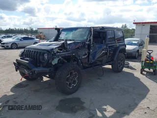 2023 Jeep Wrangler Rubicon with VIN 1C4HJXFGXPW534515, listed as a IAAI auction lot 41524419 with 21,376 mi miles and . Bid and sale history available at DreamBid. Image 17.