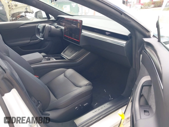 2022 Tesla Model S Plaid with VIN 5YJSA1E6XNF473888, listed as a IAAI auction lot 42141141 with 28,584 mi miles and . Bid and sale history available at carsss.com. Image 5.