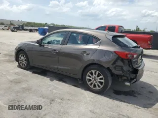 2014 Mazda 3 i Touring with VIN JM1BM1L71E1181056, listed as a Copart auction lot 59767705 with 129,447 mi miles and Salvage title. Bid and sale history available at DreamBid. Image 2.