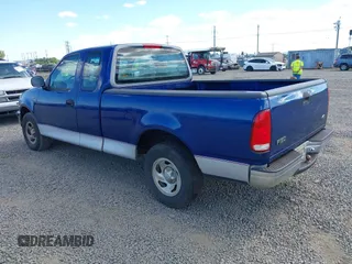 1998 Ford F-150 z VIN 2FTZX1727WCA77479, wystawiony jako IAAI lot #42685001 z przebiegiem 103 875 mil mil oraz . Historia ofert i sprzedaży dostępna na DreamBid. Obrazek 3.