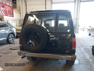 1991 Isuzu Trooper z VIN JACCH58R8M7902476, wystawiony jako IAAI lot #41893980 z przebiegiem 169 269 mil mil oraz . Historia ofert i sprzedaży dostępna na DreamBid. Obrazek 16.