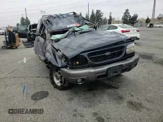 1999 Ford Explorer XLT with VIN 1FMZU34E6XZC14009, listed as a Copart auction lot 55251525 with 253,681 mi miles and Salvage title. Bid and sale history available at DreamBid. Image 14.