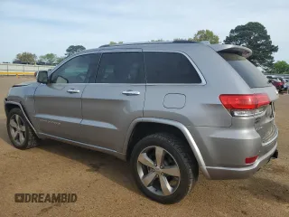 2016 Jeep Grand Cherokee Overland with VIN 1C4RJFCT2GC320247, listed as a Copart auction lot 50832195 with 104,300 mi miles and Salvage title. Bid and sale history available at DreamBid. Image 2.