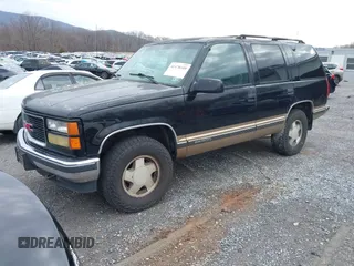 1999 GMC Yukon with VIN 1GKEK13R9XJ807786, listed as a IAAI auction lot 41478109 with 193,748 mi miles. Bid and sale history available at carsss.com. Image 2.