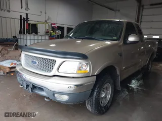 1999 Ford F-150 Work Series with VIN 1FTRX18W0XKA68363, listed as a IAAI auction lot 41524104 with 218,400 mi miles. Bid and sale history available at carsss.com. Image 18.