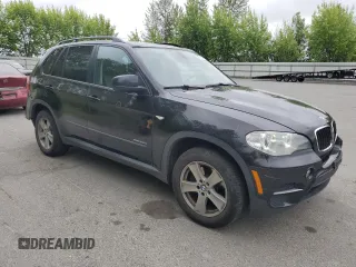 2012 BMW X5 35d with VIN 5UXZW0C54CL671377, listed as a Copart auction lot 60936395 with 105,903 mi miles and Salvage title. Bid and sale history available at DreamBid. Image 4.