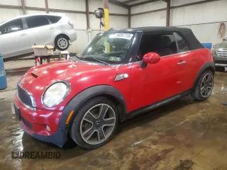 2010 MINI Convertible S with VIN WMWMS3C50ATY51636, listed as a Copart auction lot 66097715 with 103,525 mi miles and Salvage title. Bid and sale history available at DreamBid. Image 1.