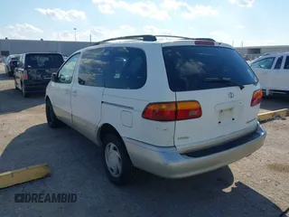1999 Toyota Sienna LE with VIN 4T3ZF13C1XU152733, listed as a IAAI auction lot 40819395 with 184,540 mi miles. Bid and sale history available at carsss.com. Image 3.