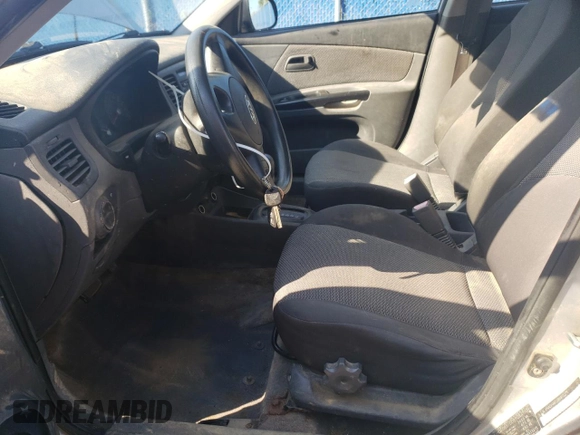 2011 Kia Rio with VIN KNADH4B32B6915275, listed as a Copart auction lot 71546484 with 297,998 mi miles and Salvage Title. Bid and sale history available at DreamBid. Image 7.