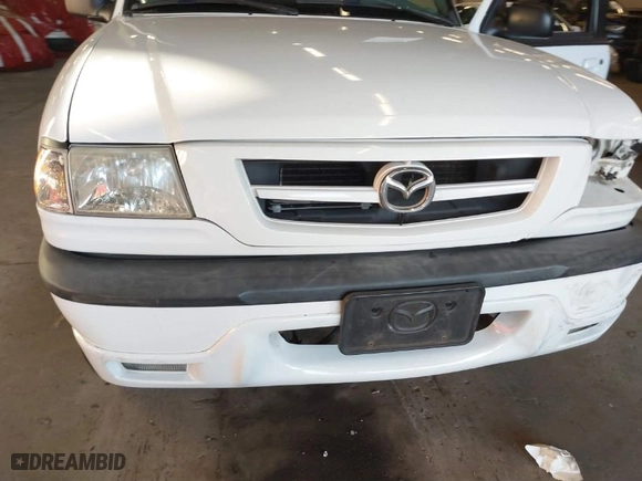 2002 Mazda B-Series 2WD Truck DS with VIN 4F4YR16V42TM25828, listed as a IAAI auction lot 41440414 with 132,334 mi miles. Bid and sale history available at carsss.com. Image 14.