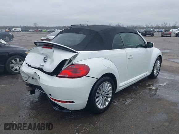 2019 Volkswagen Beetle S with VIN 3VW5DAAT4KM504847, listed as a IAAI auction lot 41582981 with 54,546 mi miles and . Bid and sale history available at DreamBid. Image 4.