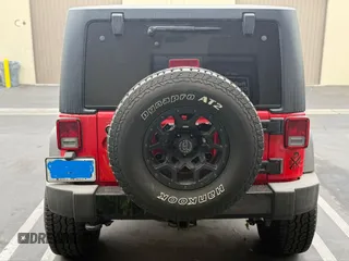 2015 Jeep Wrangler Sport with VIN 1C4AJWAG0FL750098, listed as a IAAI auction lot 41266454 with 77,115 mi miles. Bid and sale history available at carsss.com. Image 12.
